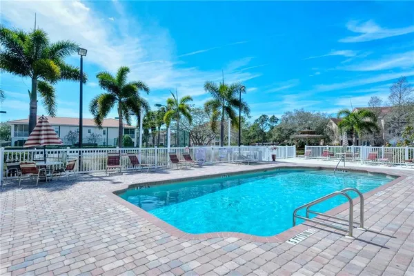 a view of a swimming pool and lounge chair