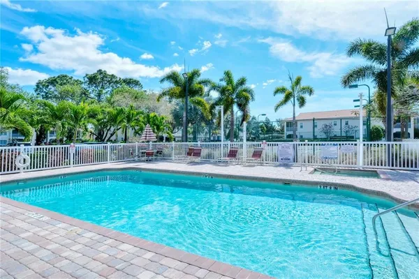 a view of a swimming pool with a patio
