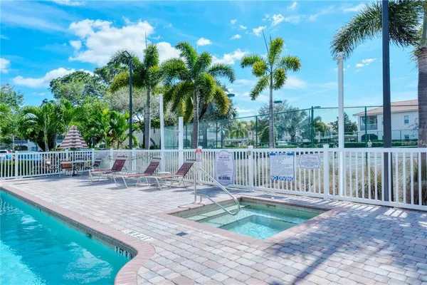 a backyard of a house with palm trees