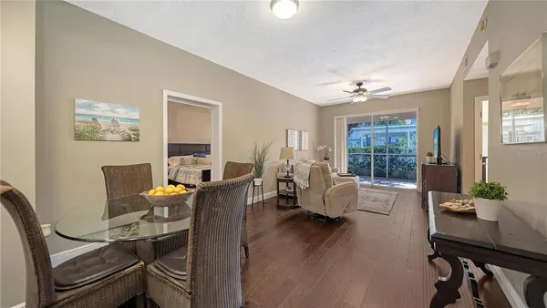 a view of a dining room with furniture window and wooden floor