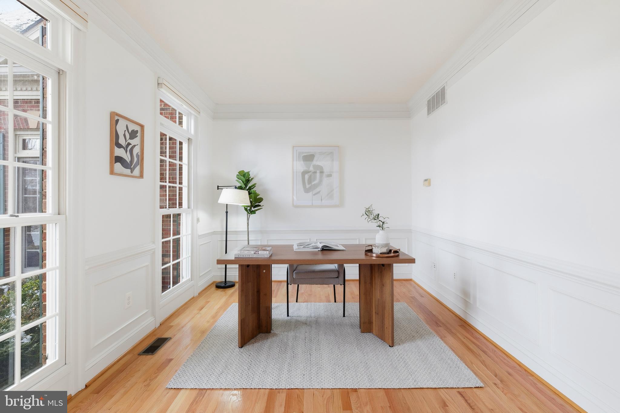 10405 Sandringham Court Potomac, MD 20854 - Photo 15 of 85 a view of a workspace with furniture and wooden floor