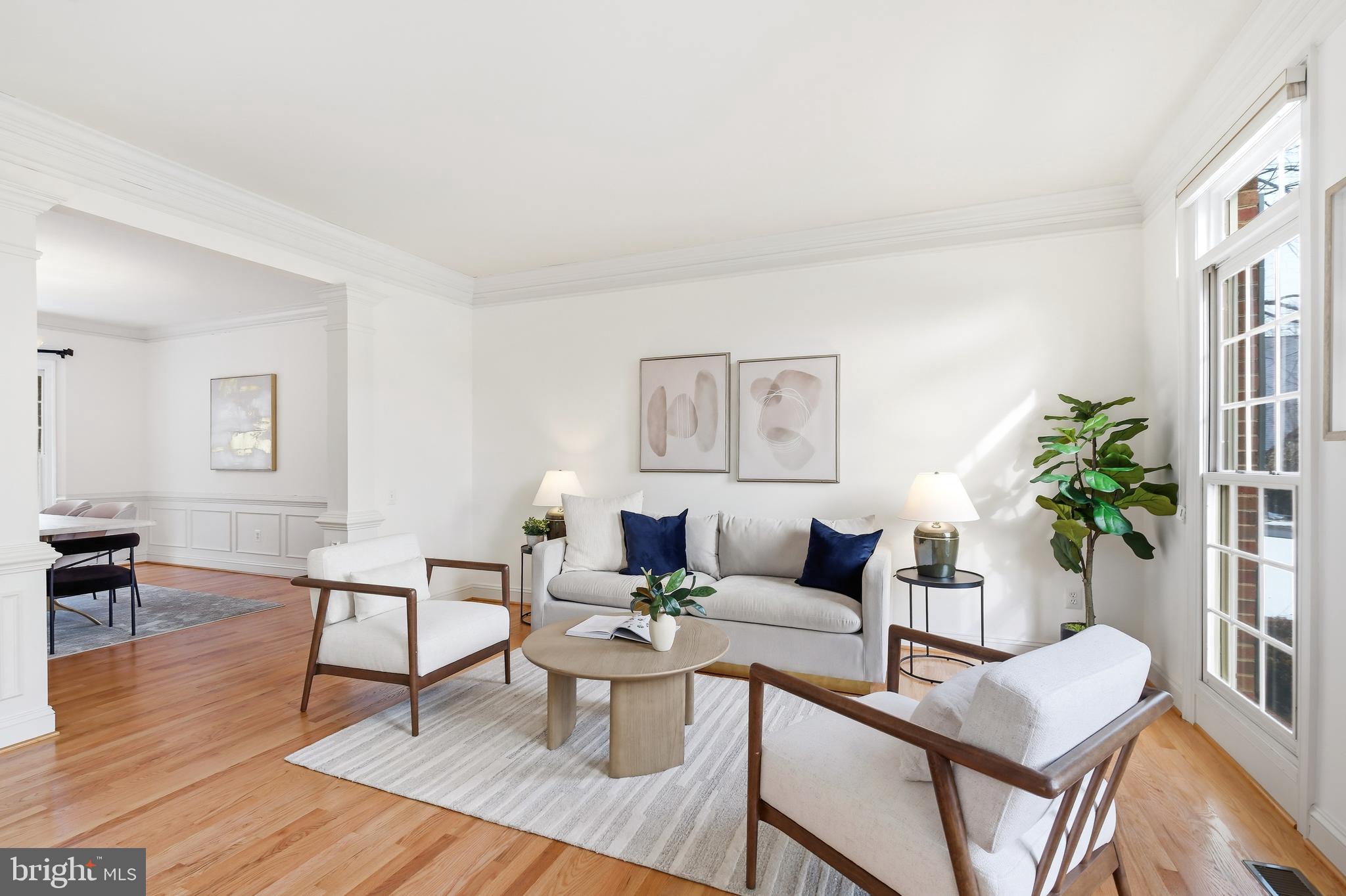 10405 Sandringham Court Potomac, MD 20854 - Photo 16 of 85 a living room with furniture and a wooden floor