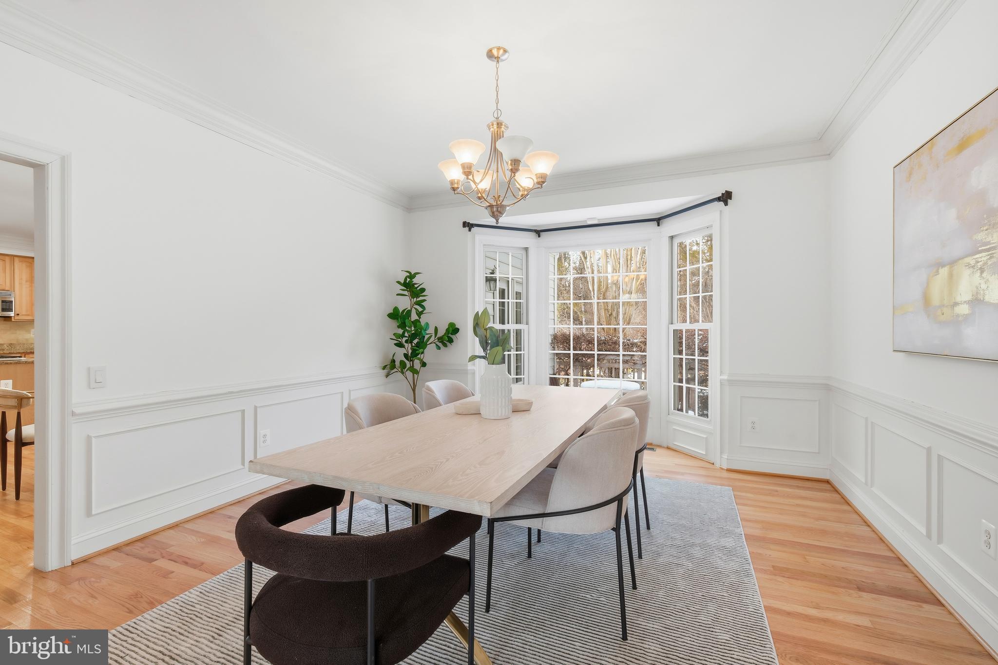 10405 Sandringham Court Potomac, MD 20854 - Photo 18 of 85 a view of a dining room with furniture window and wooden floor