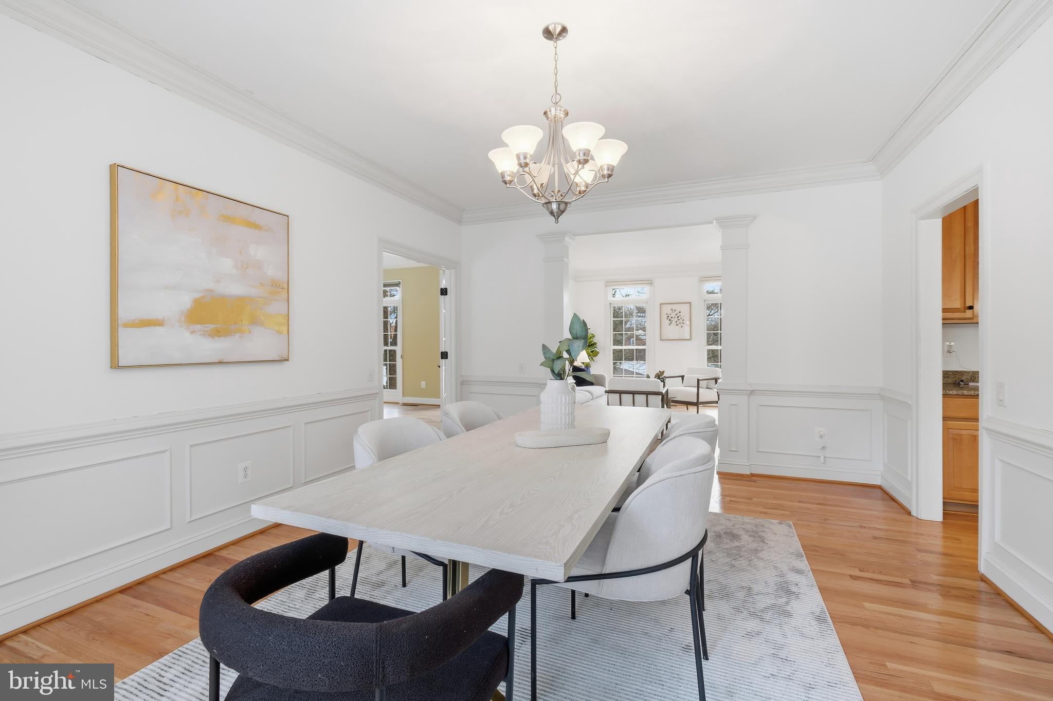 10405 Sandringham Court Potomac, MD 20854 - Photo 19 of 85 a view of a dining room with furniture and wooden floor