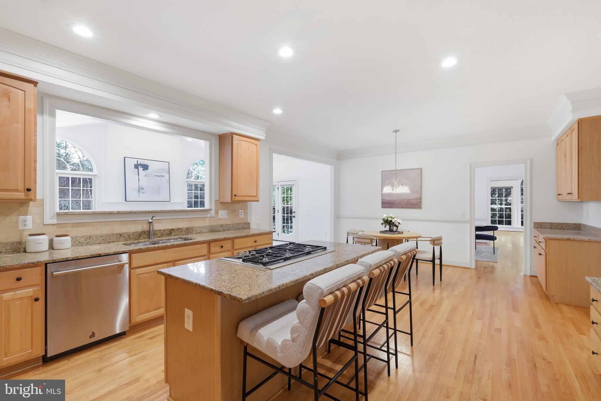 10405 Sandringham Court Potomac, MD 20854 - Photo 27 of 85 a kitchen with a table and chairs in it