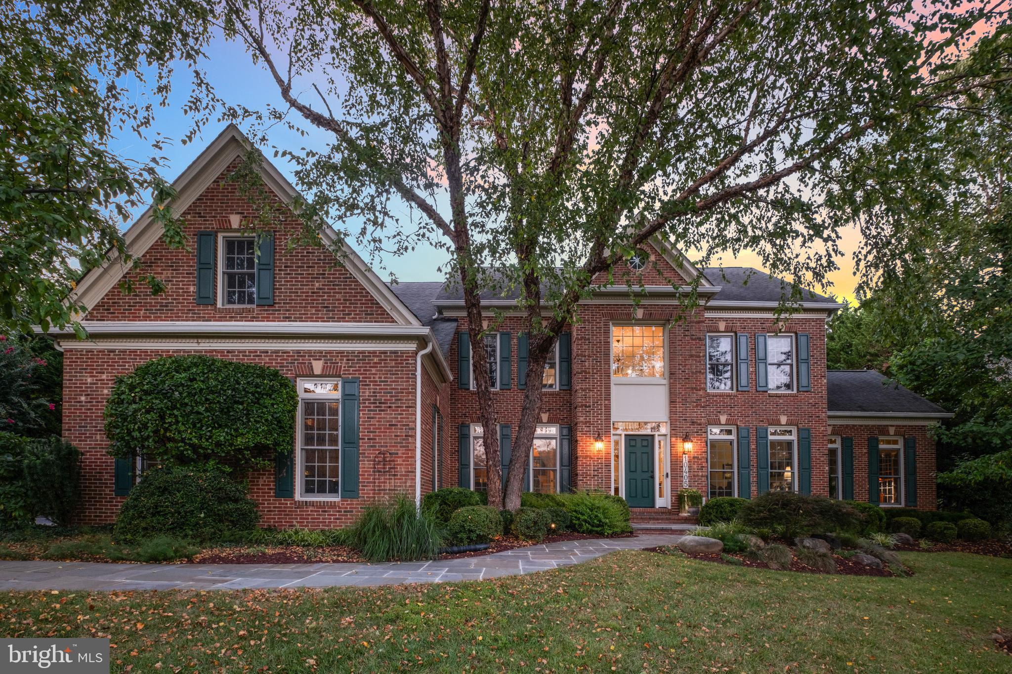 10405 Sandringham Court Potomac, MD 20854 - Photo 3 of 85 a front view of house with yard and green space