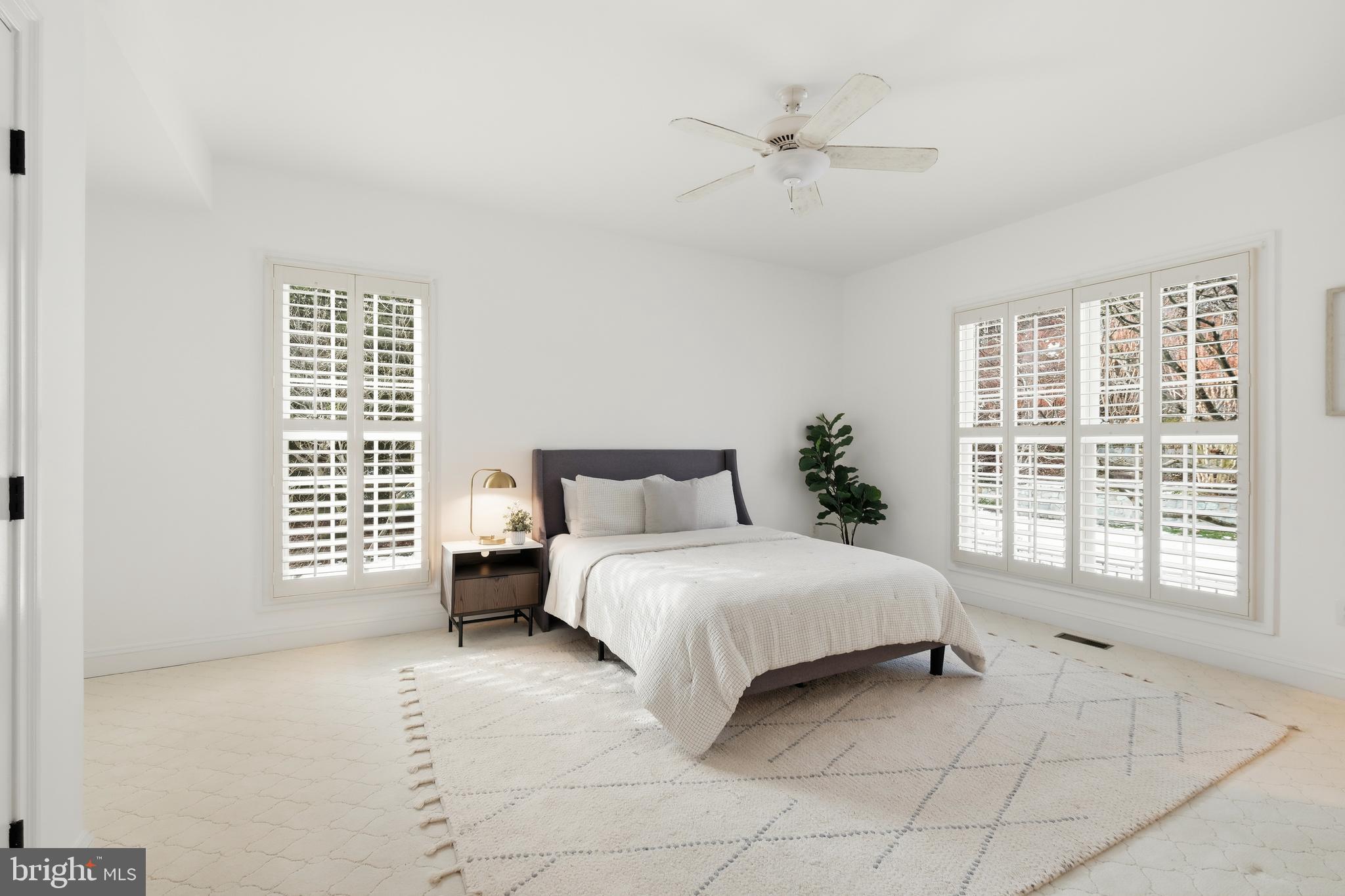 10405 Sandringham Court Potomac, MD 20854 - Photo 32 of 85 a spacious bedroom with a bed and a window
