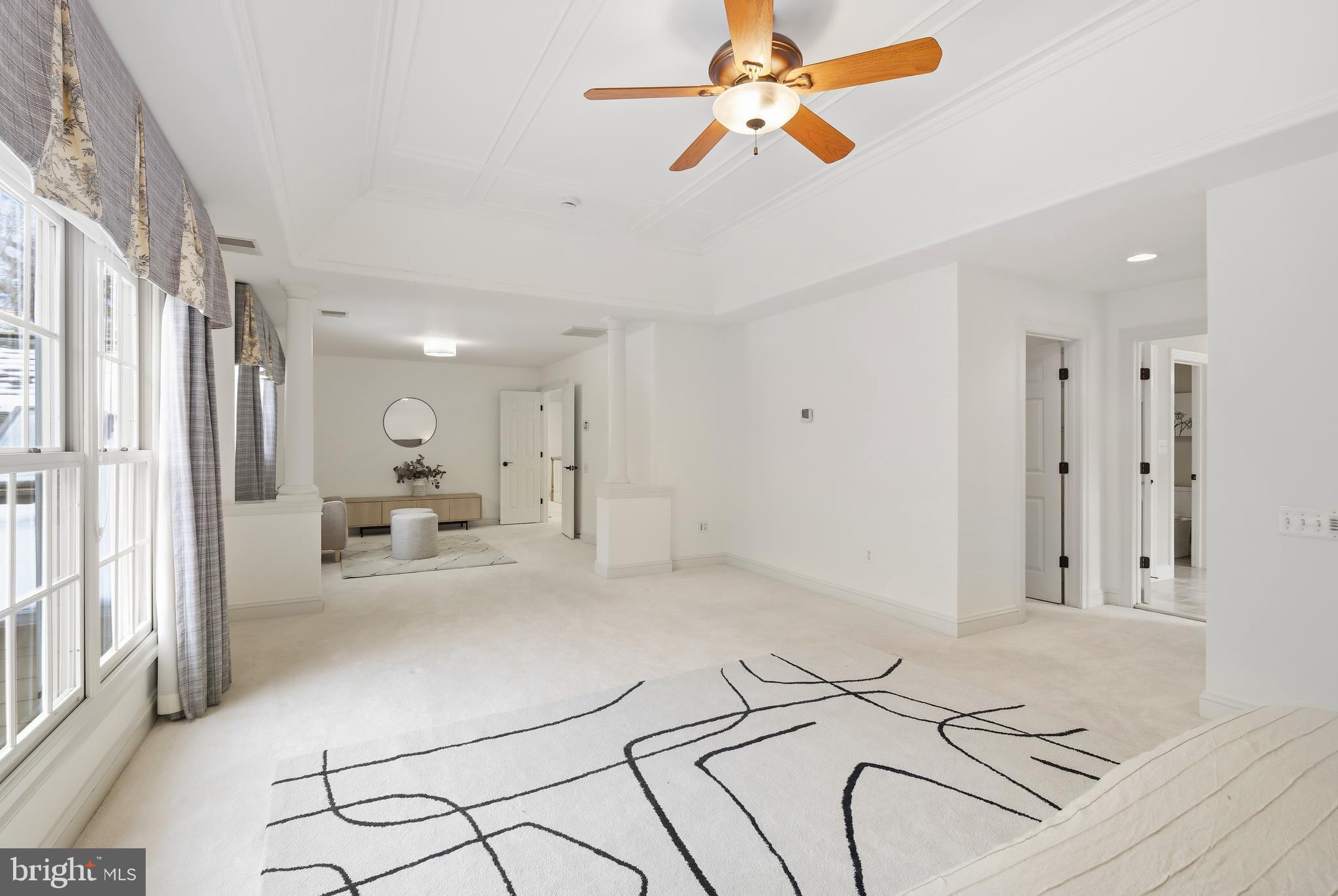 10405 Sandringham Court Potomac, MD 20854 - Photo 42 of 85 a living room with furniture and a chandelier