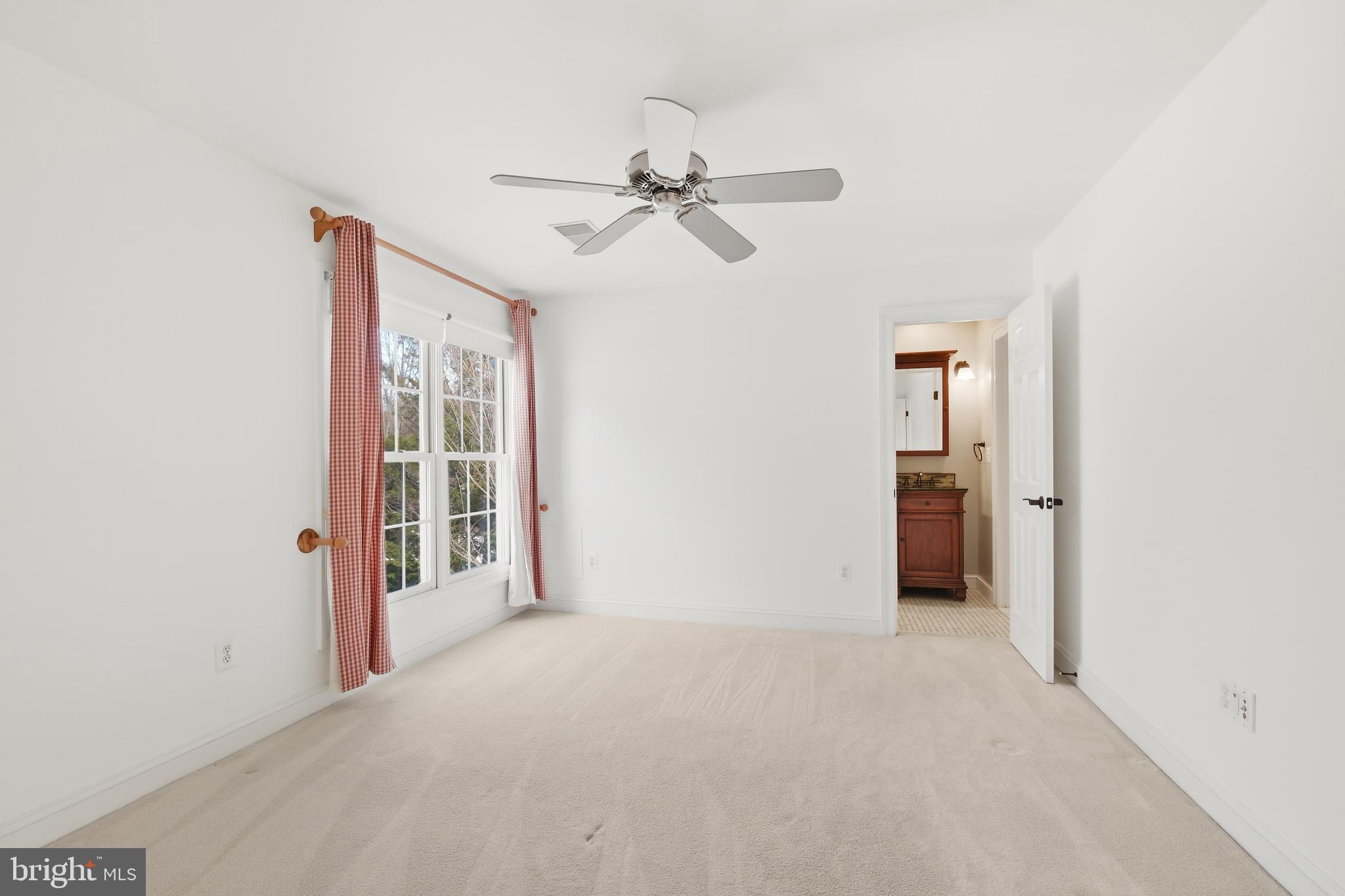 10405 Sandringham Court Potomac, MD 20854 - Photo 52 of 85 an empty room with windows and closet