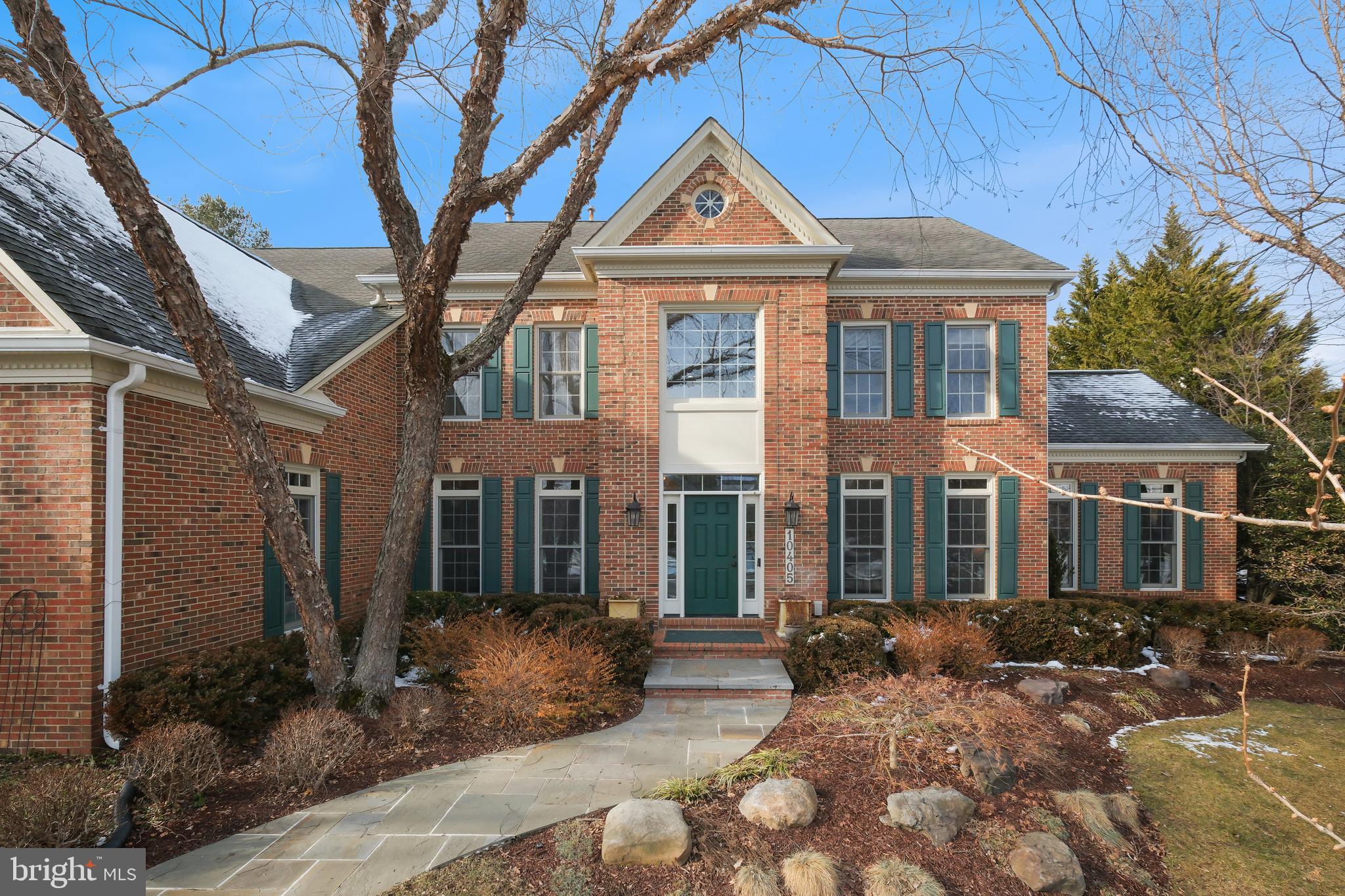 10405 Sandringham Court Potomac, MD 20854 - Photo 7 of 85 a front view of a house with garden
