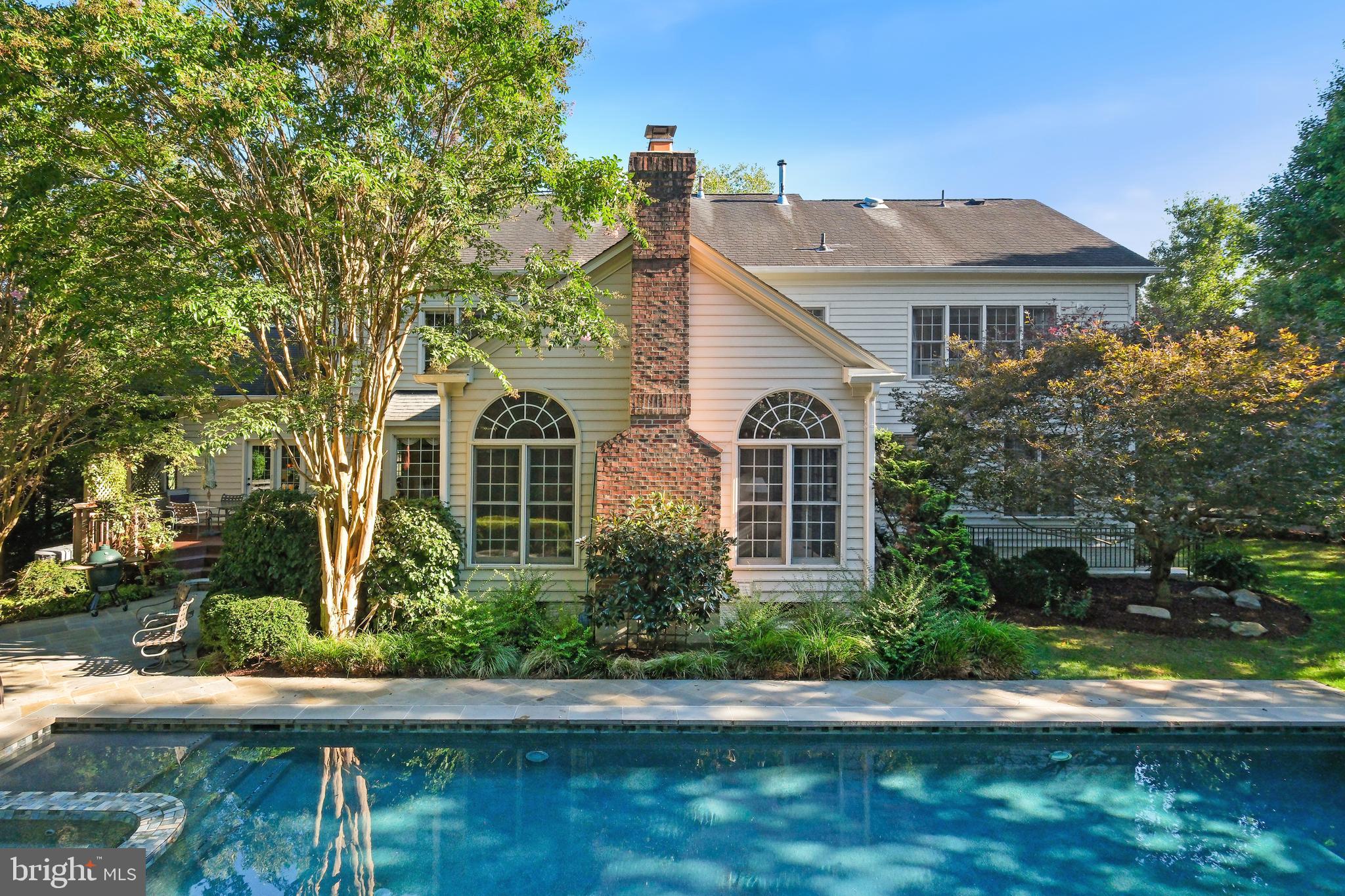 10405 Sandringham Court Potomac, MD 20854 - Photo 76 of 85 a front view of a house with a yard