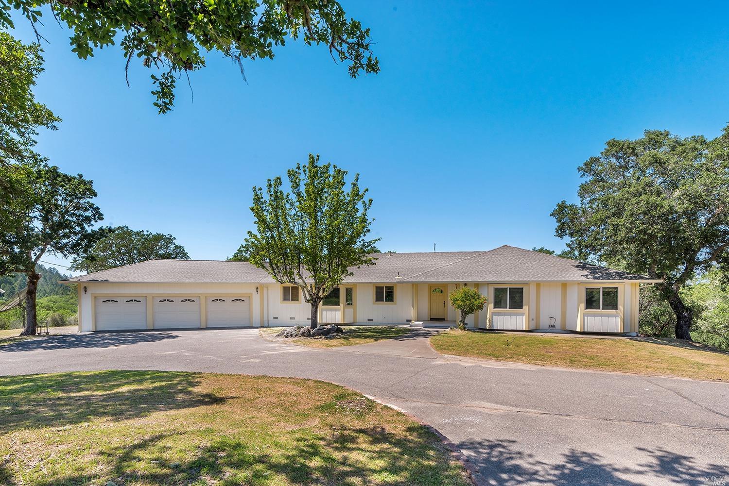 a house with trees in front of it