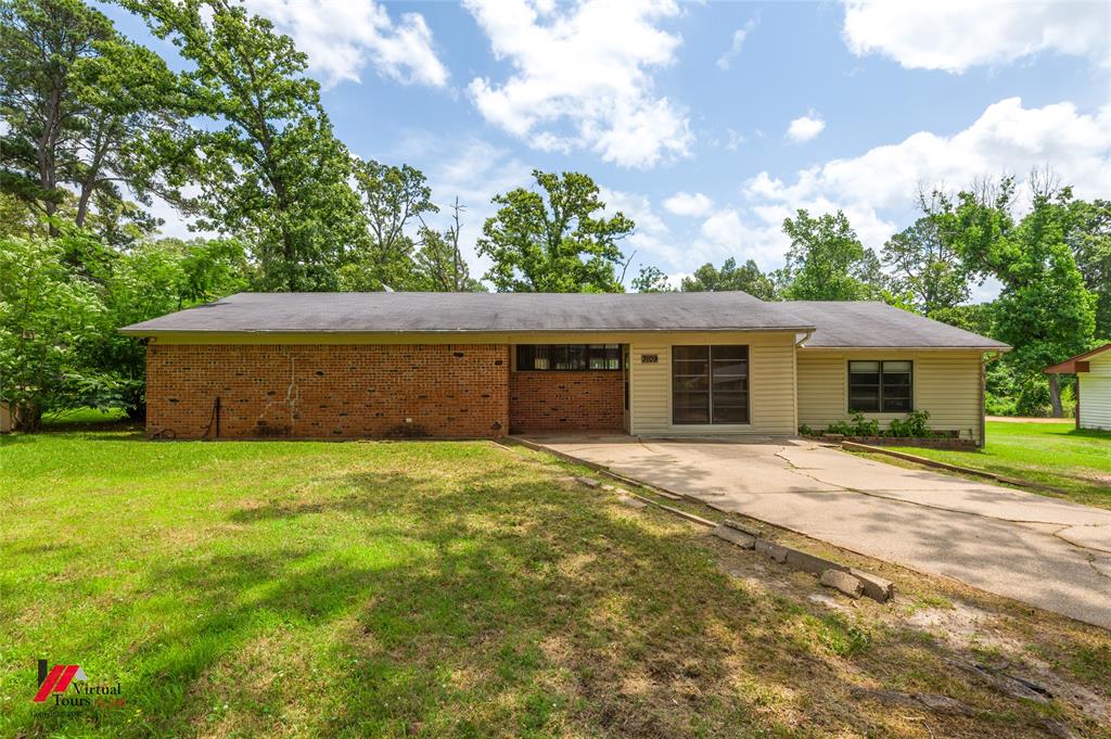 3109 Gorton Road Shreveport, LA 71119 - Photo 1 of 31 a front view of a house with a garden