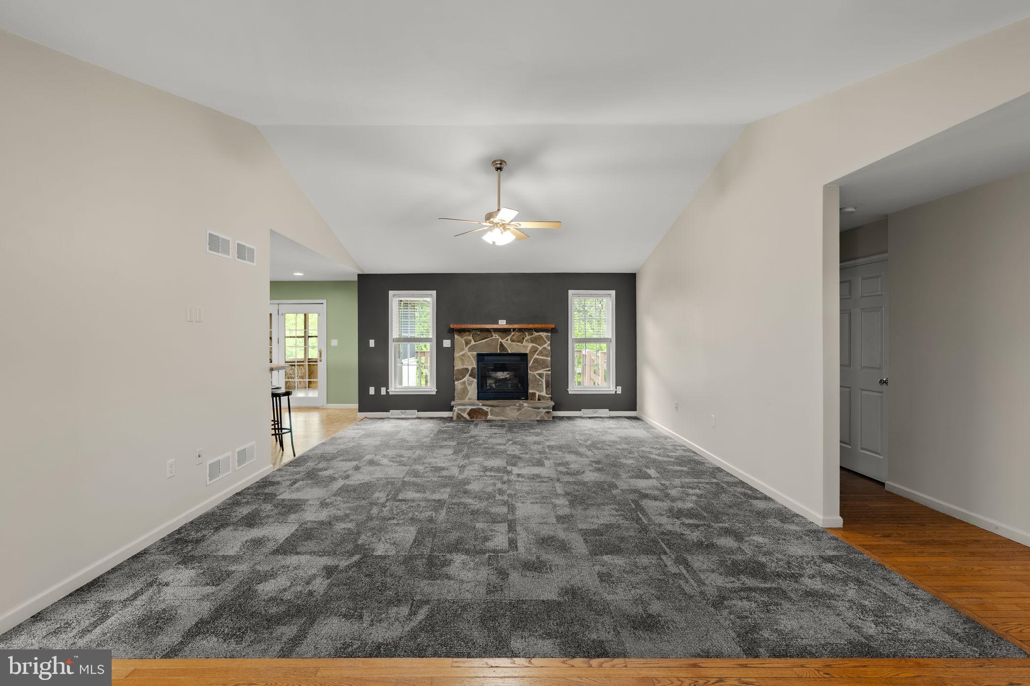 331 Brunners Grove Road Reinholds, PA 17569 - Photo 13 of 62 a view of empty room with wooden floor and fireplace