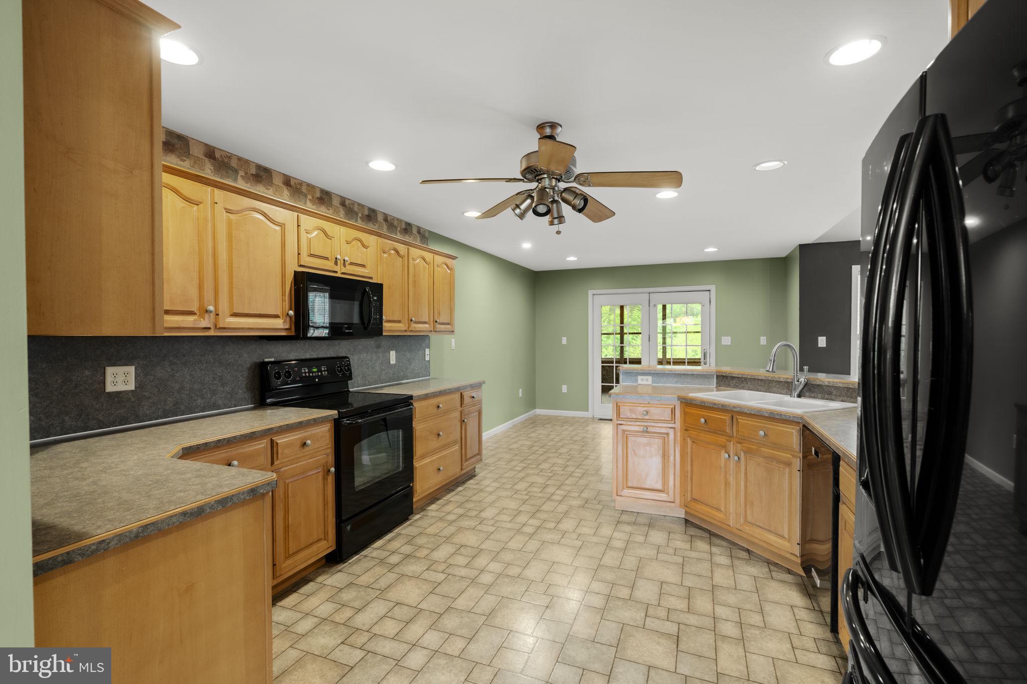 331 Brunners Grove Road Reinholds, PA 17569 - Photo 20 of 62 a kitchen with stainless steel appliances granite countertop a refrigerator a stove top oven a sink and dishwasher