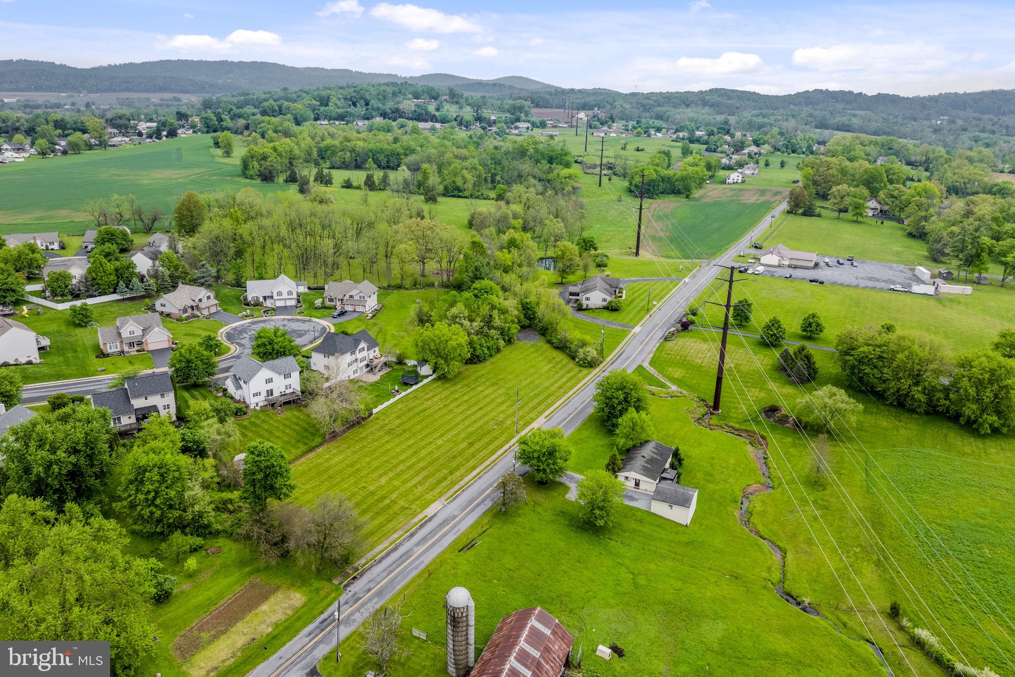 331 Brunners Grove Road Reinholds, PA 17569 - Photo 9 of 62 a view of a city with lush green forest