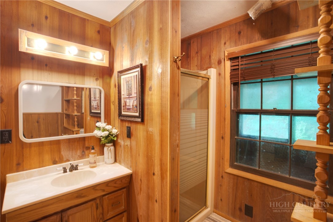 9440 Blackberry Road Lenoir, NC 28645 - Photo 15 of 30 a bathroom with a sink and a mirror