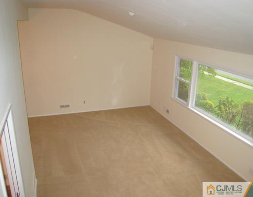 10 Gulf Road East Brunswick, NJ 08816 - Photo 6 of 25 an empty room with a window