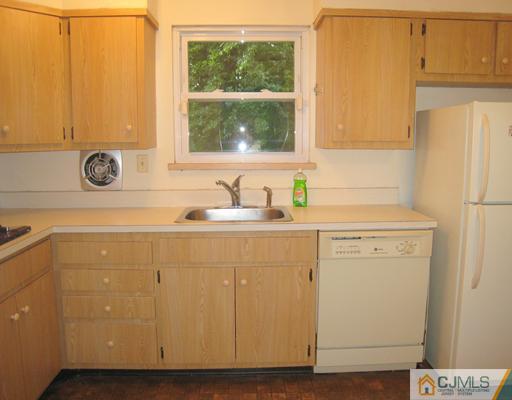 10 Gulf Road East Brunswick, NJ 08816 - Photo 8 of 25 a bathroom with a sink and a window