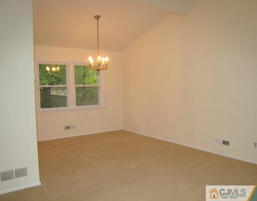 10 Gulf Road East Brunswick, NJ 08816 - Photo 10 of 25 a view of an empty room with windows