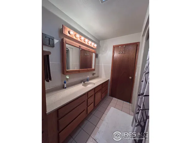 a view of entryway with a small yard and a potted plant