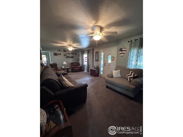 a room with a couch and a wooden floor