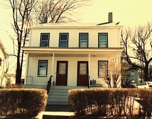 271 Cove Road Stamford, CT 06902 - Photo 1 of 1 a front view of a house with a yard