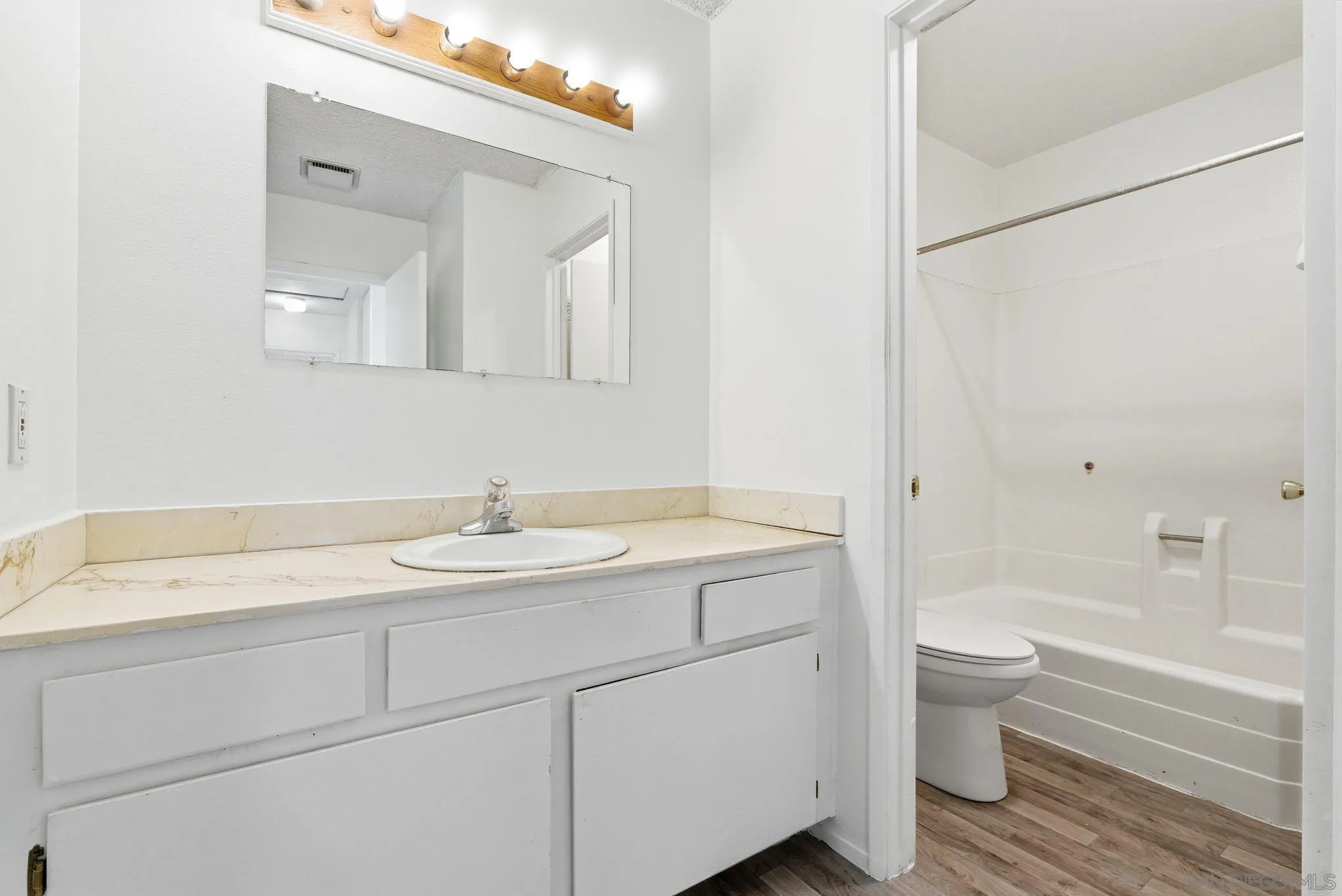 262 Rancho Drive, Unit C Chula Vista, CA 91911 - Photo 14 of 29 a bathroom with a sink and a mirror