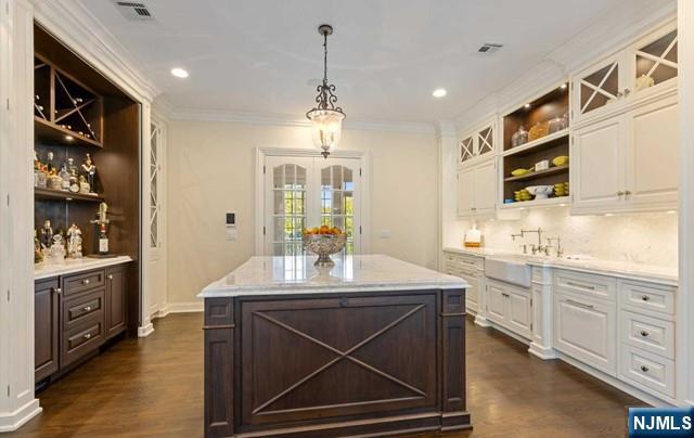 51 Chestnut Ridge Road Saddle River, NJ 07458 - Photo 11 of 45 a kitchen with stainless steel appliances a sink stove and cabinets