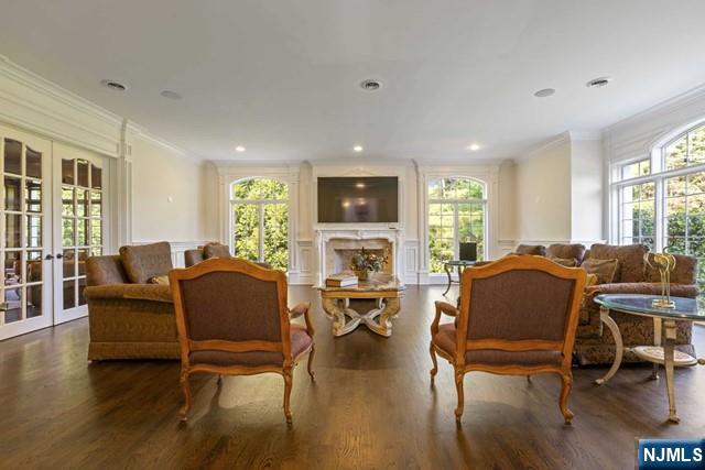 51 Chestnut Ridge Road Saddle River, NJ 07458 - Photo 14 of 45 a living room with fireplace furniture and a wooden floor