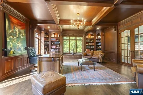 a living room with furniture a rug and a large window