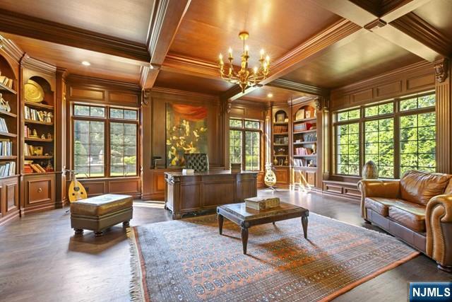 51 Chestnut Ridge Road Saddle River, NJ 07458 - Photo 16 of 45 a living room with furniture a rug and a large window