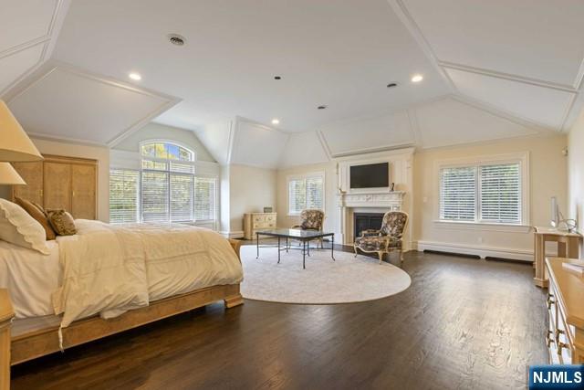 51 Chestnut Ridge Road Saddle River, NJ 07458 - Photo 19 of 45 a spacious bedroom with a bed a table and large windows