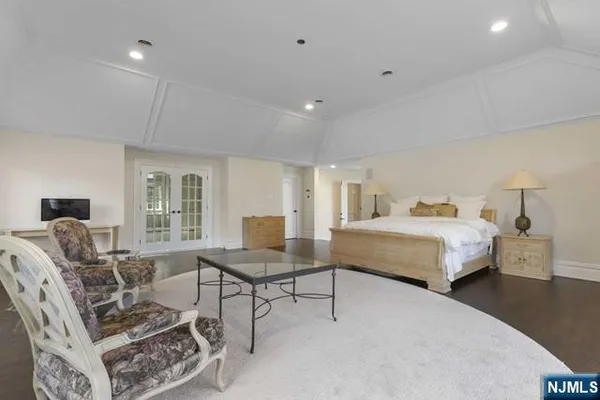 a bathroom with a bathtub shower sink and mirror