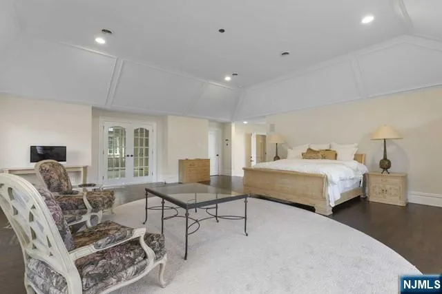 a bathroom with a bathtub shower sink and mirror