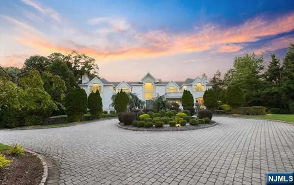 a view of entryway and hall with a chandelier