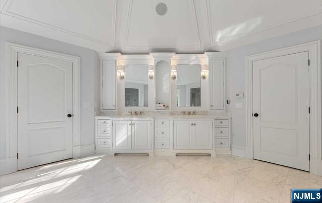 51 Chestnut Ridge Road Saddle River, NJ 07458 - Photo 22 of 45 a bathroom with a granite countertop sink and a mirror