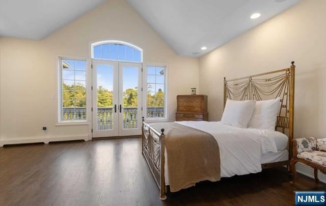 51 Chestnut Ridge Road Saddle River, NJ 07458 - Photo 23 of 45 a spacious bedroom with a bed and wooden floor