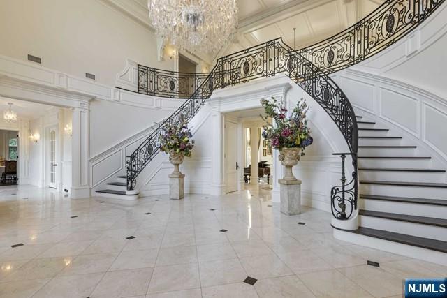 51 Chestnut Ridge Road Saddle River, NJ 07458 - Photo 3 of 45 a view of entryway and hall with a chandelier