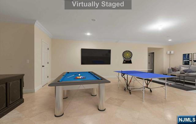 51 Chestnut Ridge Road Saddle River, NJ 07458 - Photo 31 of 45 a living room with furniture pool table and a flat screen tv