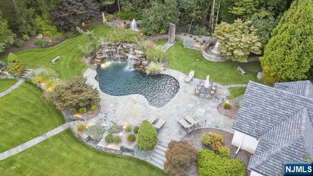 51 Chestnut Ridge Road Saddle River, NJ 07458 - Photo 32 of 45 an aerial view of a house with yard swimming pool and outdoor seating