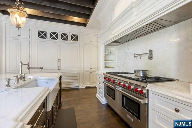 51 Chestnut Ridge Road Saddle River, NJ 07458 - Photo 9 of 45 a kitchen with a stove and a sink