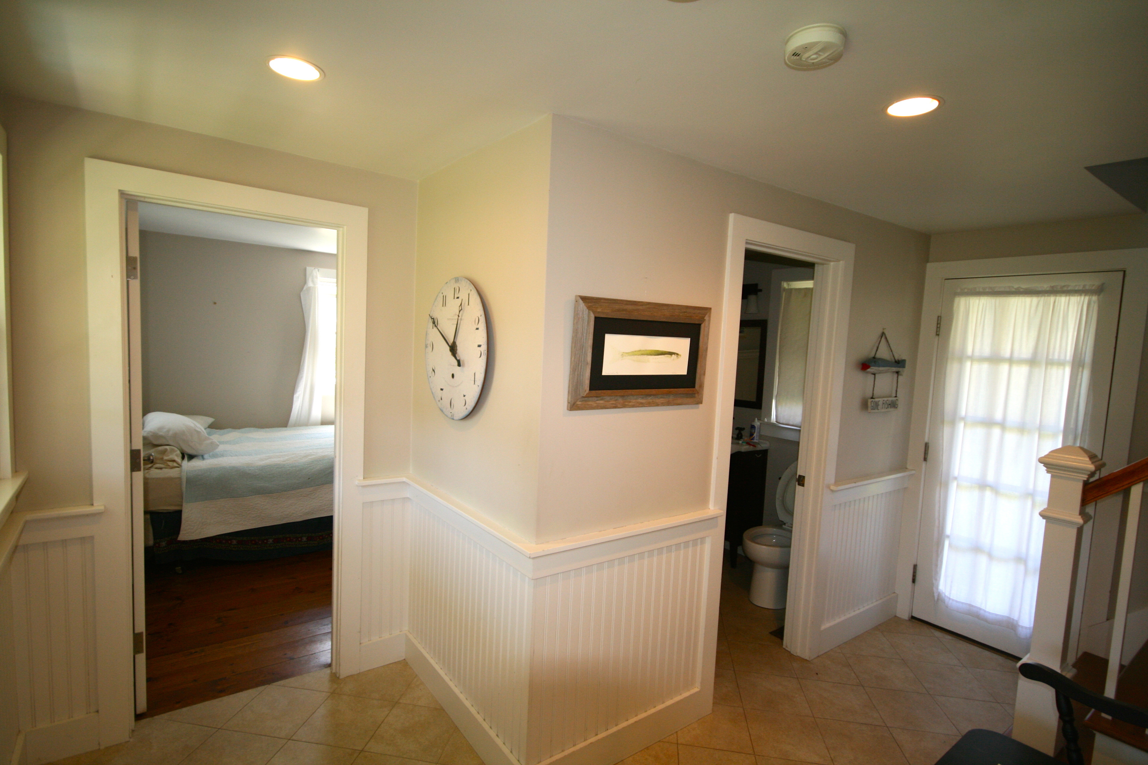 29 South A S Shore Road, Unit A Nantucket, MA 02554 - Photo 5 of 19 a bedroom with a bed and a mirror