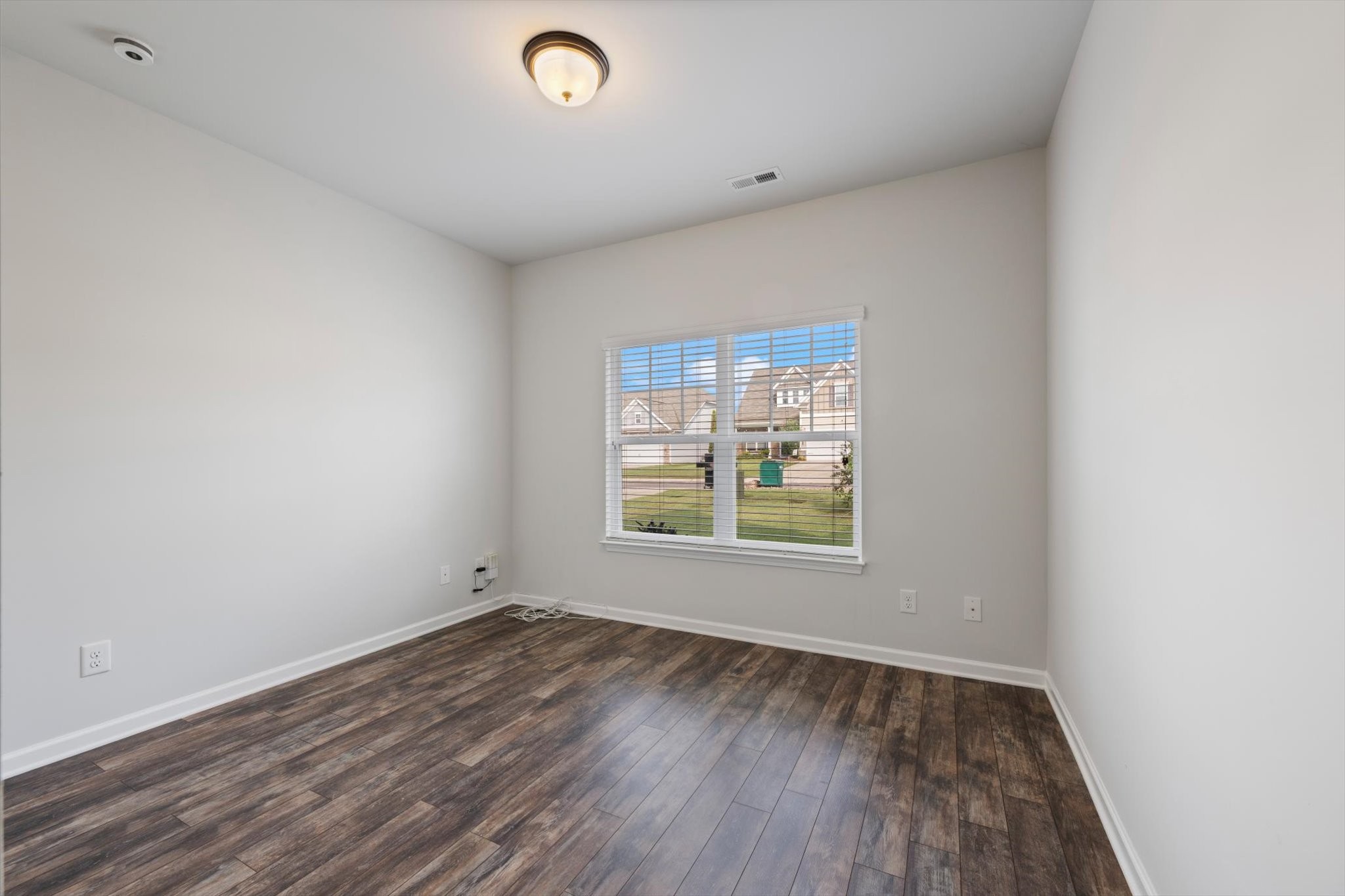 920 Carnation Drive Spring Hill, TN 37174 - Photo 19 of 27 an empty room with wooden floor and windows