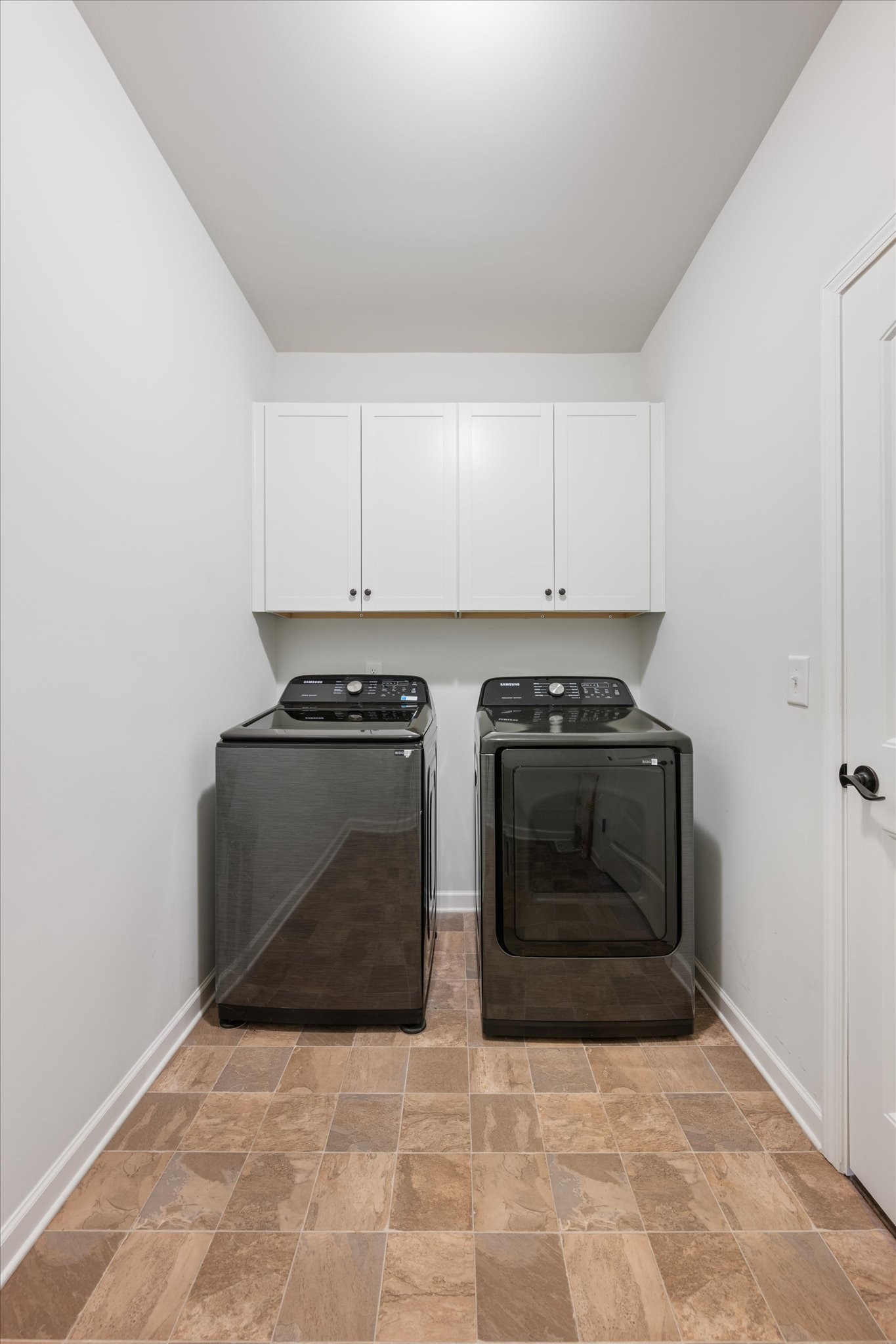 920 Carnation Drive Spring Hill, TN 37174 - Photo 23 of 27 a kitchen with granite countertop a stove and a microwave