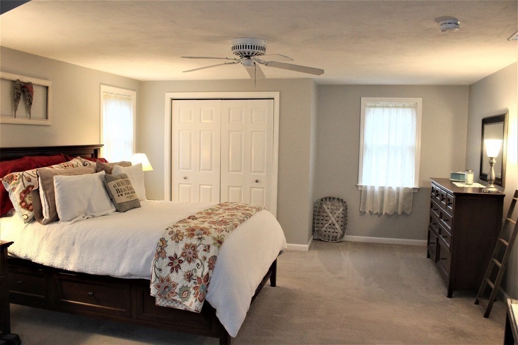 7 Michael Road Franklin, MA 02038 - Photo 22 of 26 a bedroom with a bed and a dresser