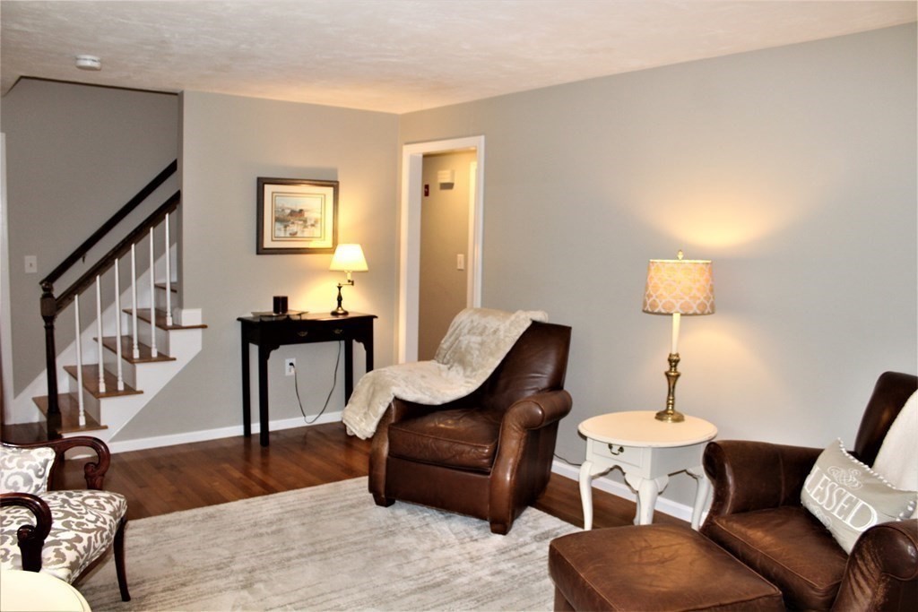 7 Michael Road Franklin, MA 02038 - Photo 8 of 26 a living room with furniture and a wooden floor