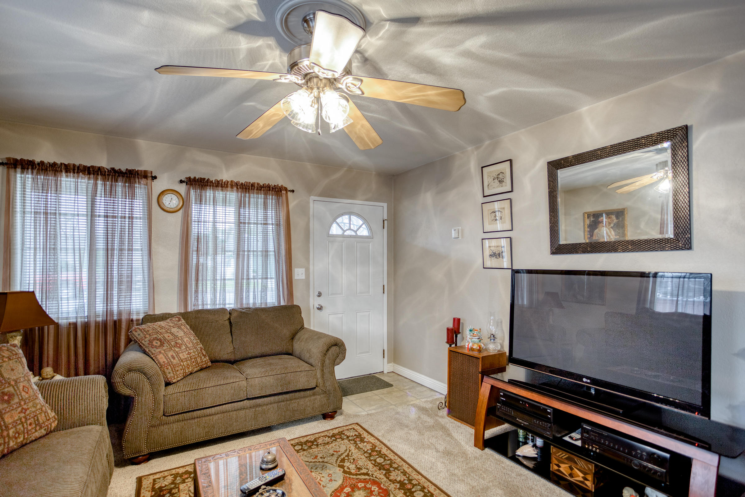 2851 Irwin Road Redding, CA 96002 - Photo 5 of 28 a living room with furniture and a flat screen tv