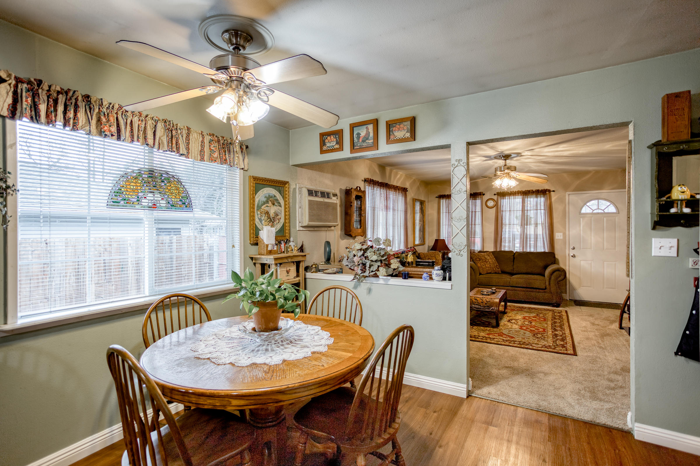 2851 Irwin Road Redding, CA 96002 - Photo 7 of 28 a view of a dining room with furniture wooden floor and chandelier