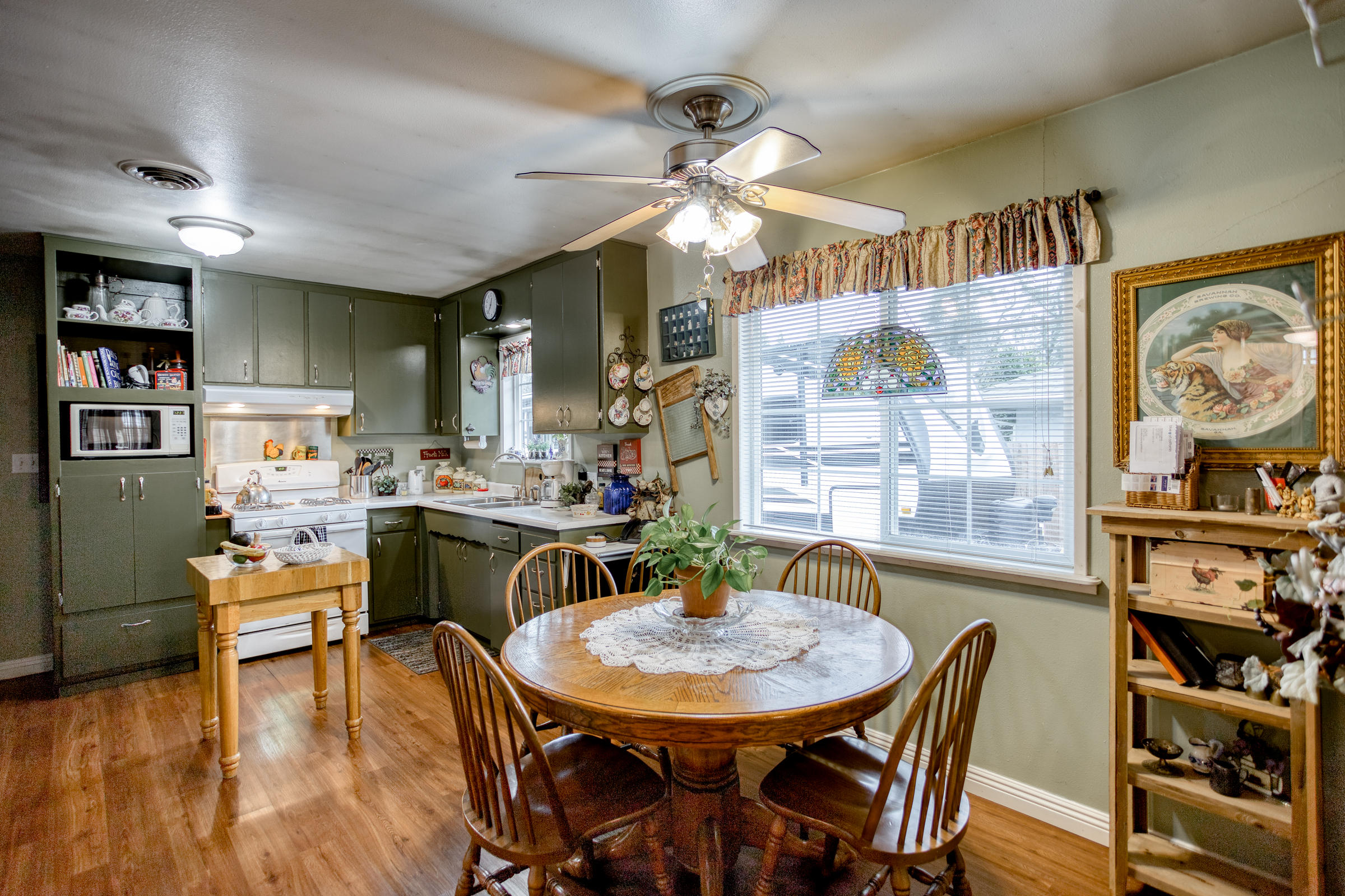 2851 Irwin Road Redding, CA 96002 - Photo 8 of 28 a view of a dining room with furniture and wooden floor